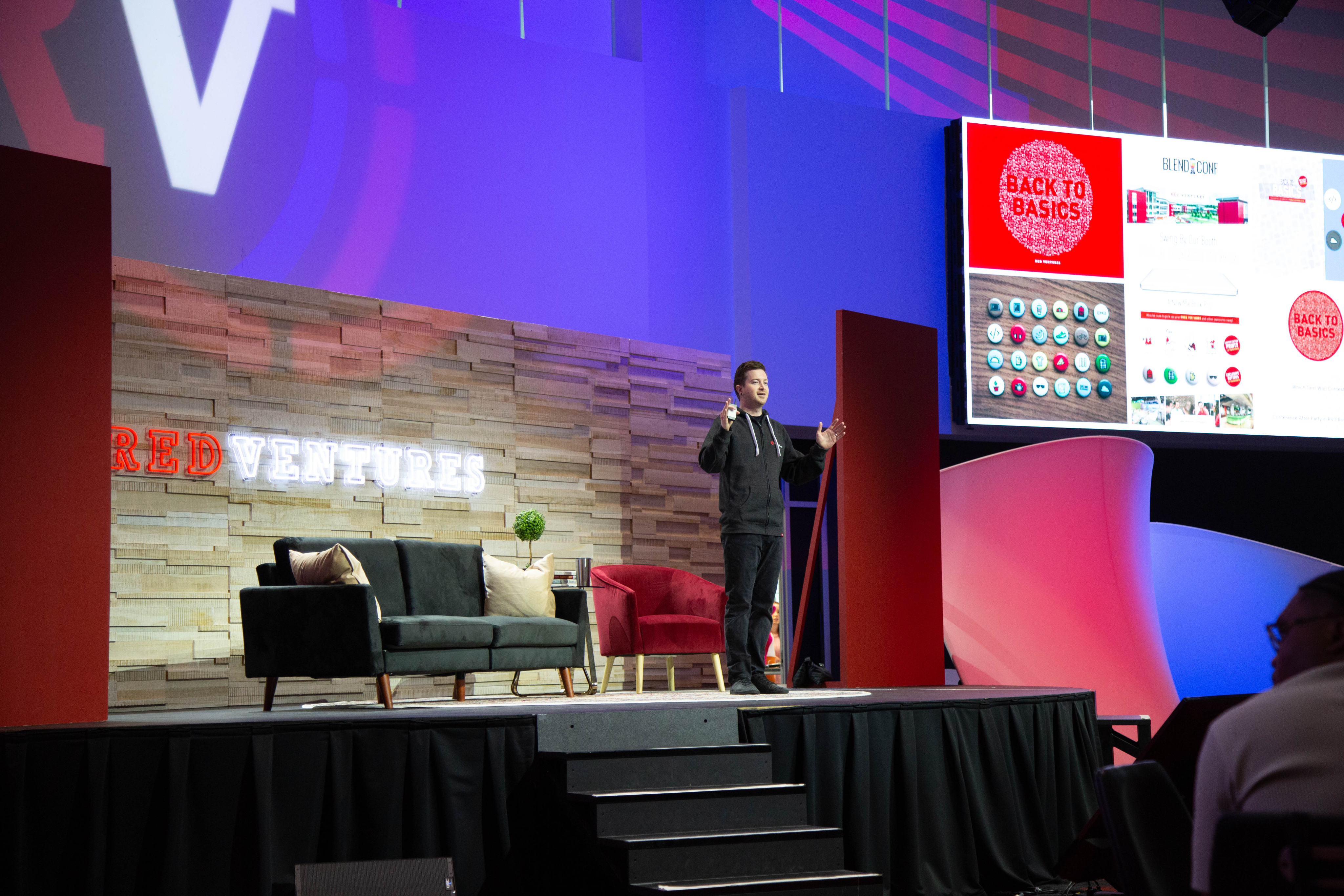 Adam Iscrupe on stage presenting A decade of RV Creative